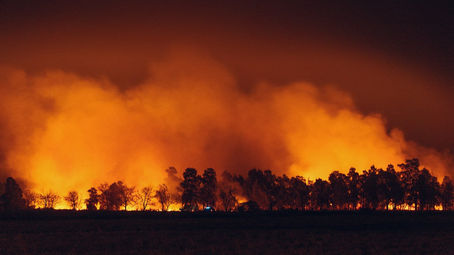 Wildfire and smoke across a landscape